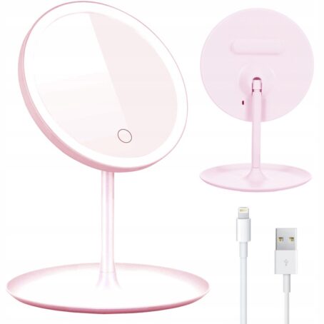 Różowe lusterko kosmetyczne z podświetleniem LED, stojące na okrągłej podstawie. Na zdjęciu widok z przodu i z tyłu lusterka, a także kabel USB do ładowania.